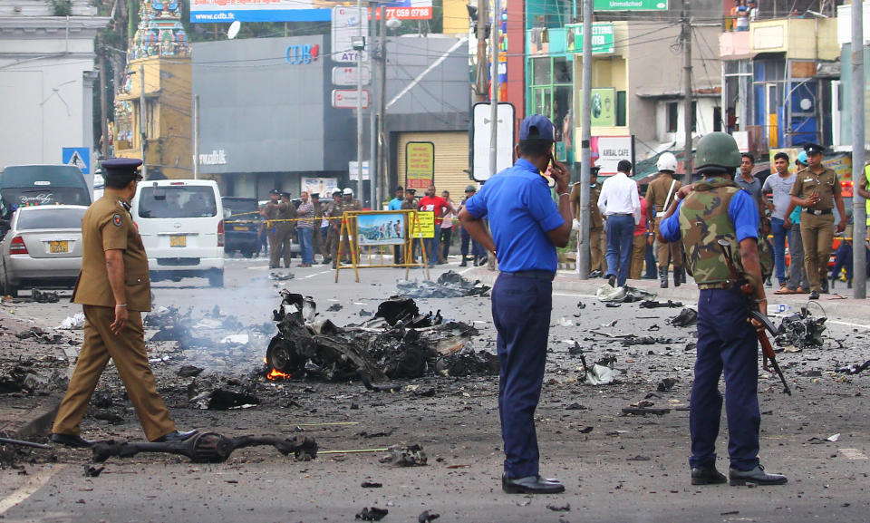 Sri Lankan security personnel inspect the debris of a car after it explodes when police tried to defuse a bomb near St. Anthony's Shrine in Colombo, Sri Lanka on April 22, 2019, a day after the series of bomb blasts targeting churches and luxury hotels in Sri Lanka. The death toll from bomb blasts that ripped through churches and luxury hotels in Sri Lanka rose dramatically on April 22, to 290. (Photo by Pradeep Dambarage/Pacific Press/Sipa USA)