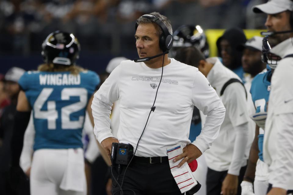 Jacksonville Jaguars heads coach Urban Meyer, center, watches play against the Dallas Cowboys in the first half of a preseason NFL football game in Arlington, Texas, Sunday, Aug. 29, 2021. (AP Photo/Michael Ainsworth)