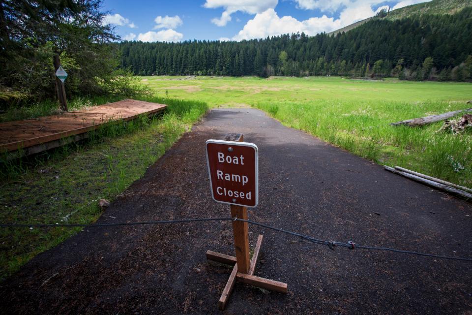 The Cascara Campground boat ramp opens up to a field due to low water levels at Fall Creek Reservoir on May 9.