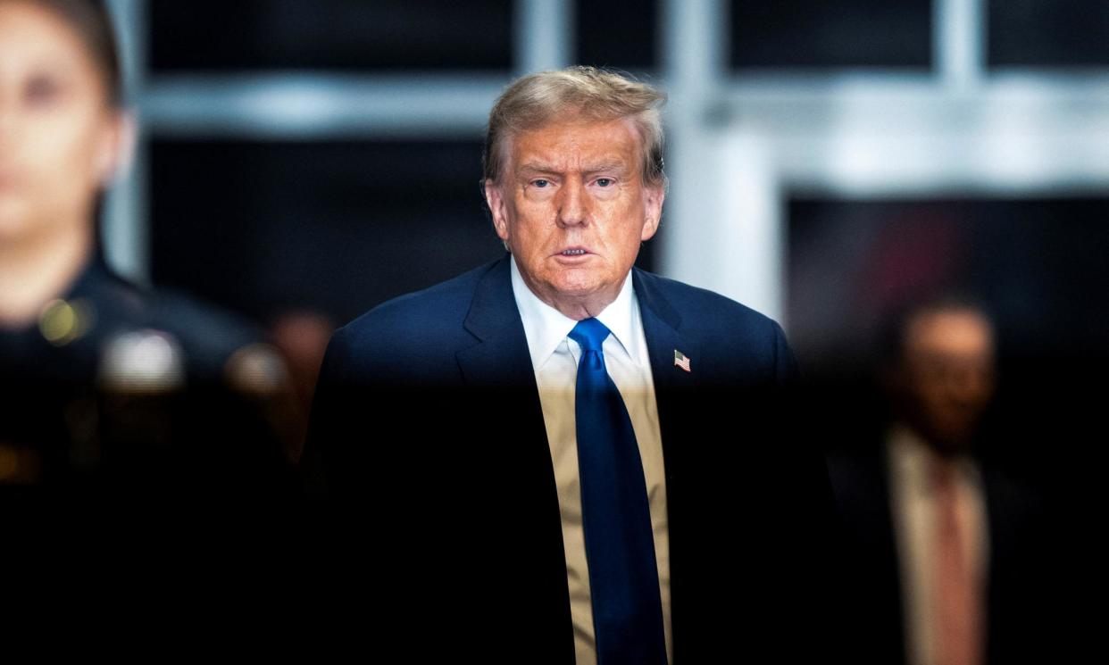 <span>Donald Trump leaves court at the end of the day on Thursday.</span><span>Photograph: Jabin Botsford/Reuters</span>