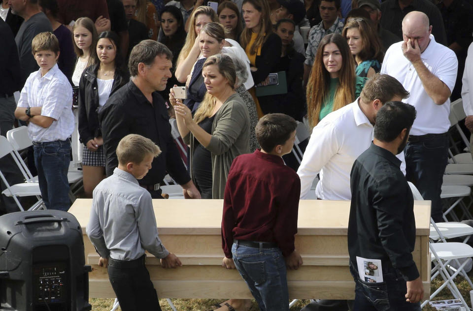 Youths and men carry a coffin during the funeral of Dawna Ray Langford, 43, and her sons Trevor, 11, and Rogan, 2, who were killed by drug cartel gunmen, at the cemetery in La Mora, Sonora state, Mexico, Thursday, Nov. 7, 2019. Three women and six of their children, all members of the extended LeBaron family, died when they were gunned down in an attack while traveling along Mexico&#39;s Chihuahua and Sonora state border on Monday. (AP Photo/Marco Ugarte)