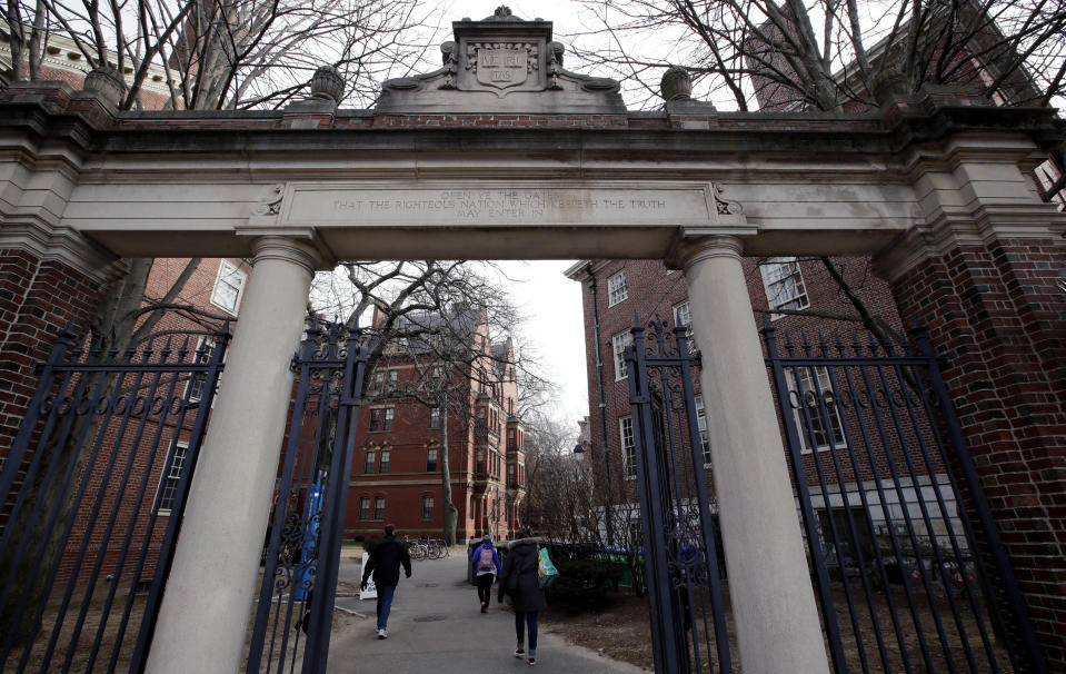 FILE - In this Dec. 13, 2018, file photo, a gate opens to the Harvard University campus in Cambridge, Mass. The Ivy League university announced Monday, June 17, 2019, that it would revoke an admission offer to a survivor of the Parkland high school massacre because of racist social media posts. The decision serves as a reminder to aspiring college students and all young people that their online comments, even those considered private, can resurface and be used against them. (AP Photo/Charles Krupa, File)