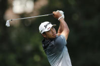 Hideki Matsuyama watches his drive on the 11th tee during the first round of the Rocket Mortgage Classic golf tournament, Thursday, July 2, 2020, at the Detroit Golf Club in Detroit. (AP Photo/Carlos Osorio)