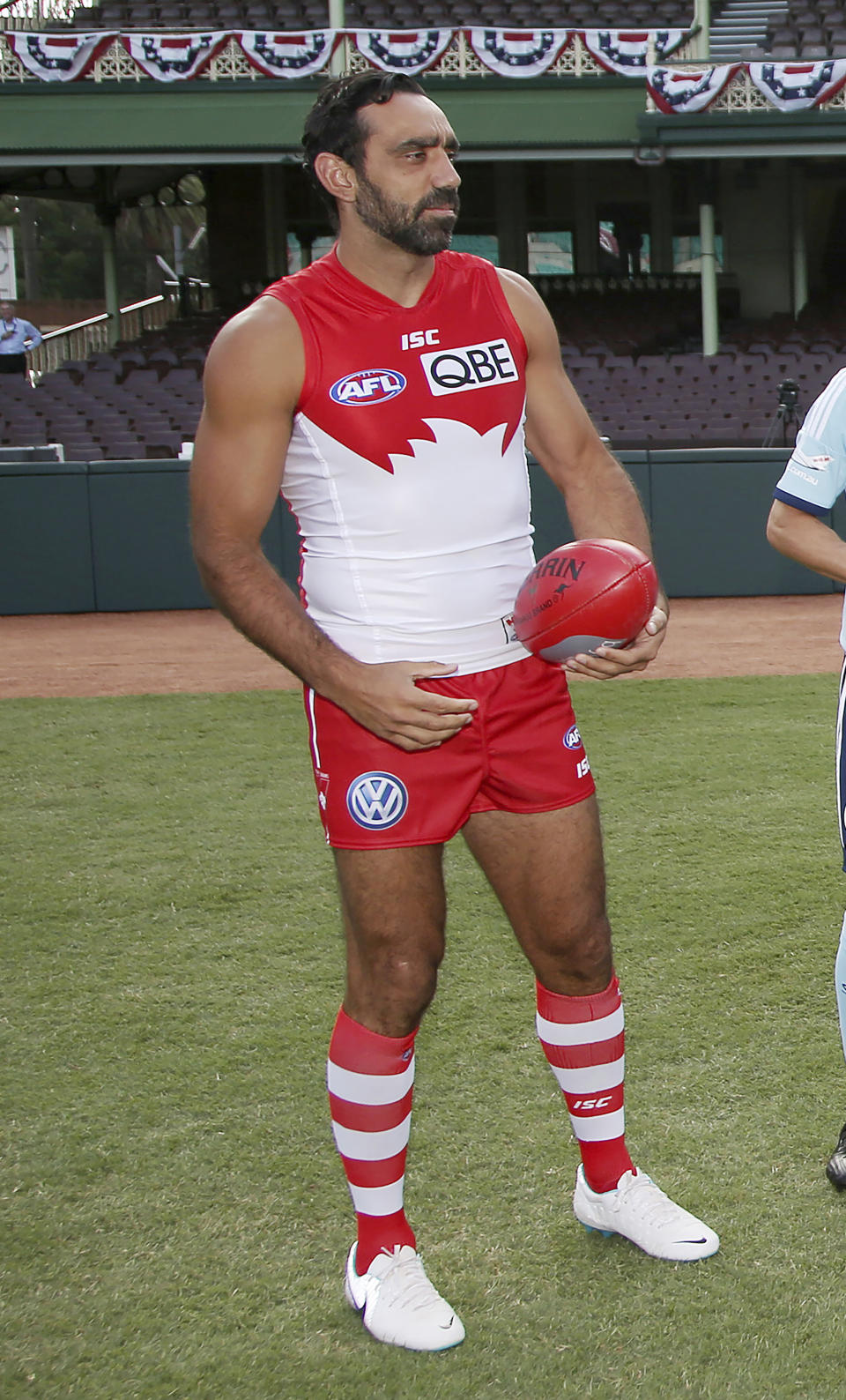 FILE - In this March 19, 2014, file photo, Sydney Swans player Adam Goodes holds an Australian Rules Football at the Sydney Cricket Ground. Goodes has declined an offer to be inducted into the Melbourne-based AFL's Hall of Fame. (AP Photo/Rick Rycroft, File)