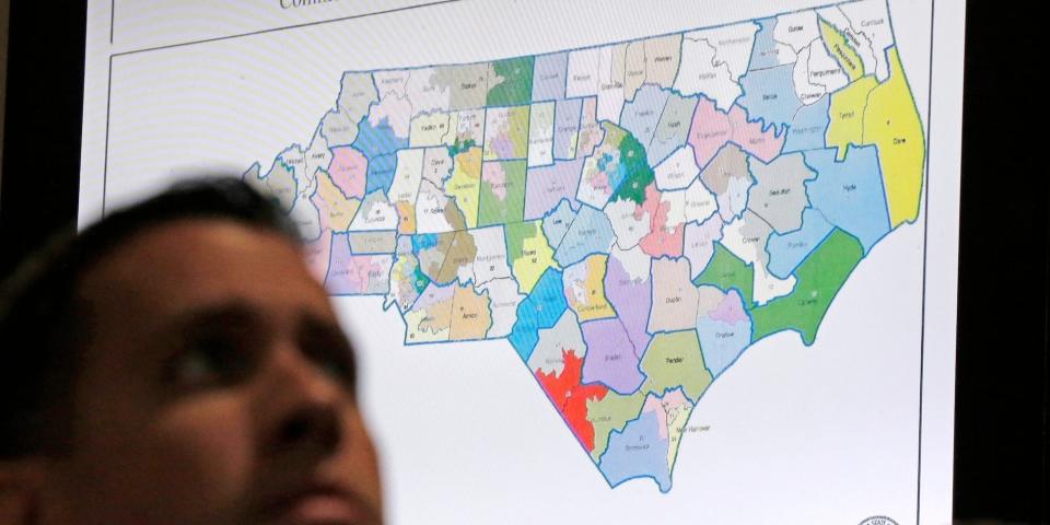 In this Monday, July 15, 2019 file photo, a state districts map is shown as a three-judge panel of the Wake County Superior Court presides over the trial of Common Cause, et al. v. Lewis, et al, in Raleigh, N.C