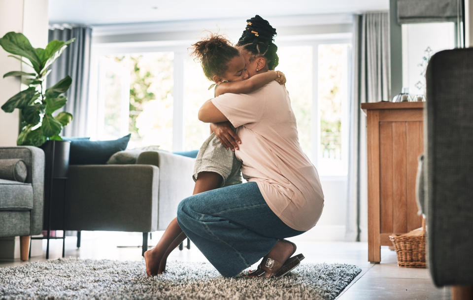 a parent and child hugging each other