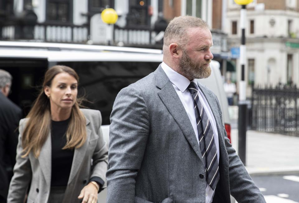 Former England footballer Wayne Rooney and his wife Coleen Rooney arrive at the Royal Courts of Justice during the fifth day of the high-profile trial against Coleen Rooney who is being sued for libel by Rebekah Vardy after Mrs Rooney publicly accused her of leaking private stories to the press in London, United Kingdom on May 16, 2022. (Photo by Rasid Necati Aslim/Anadolu Agency via Getty Images)