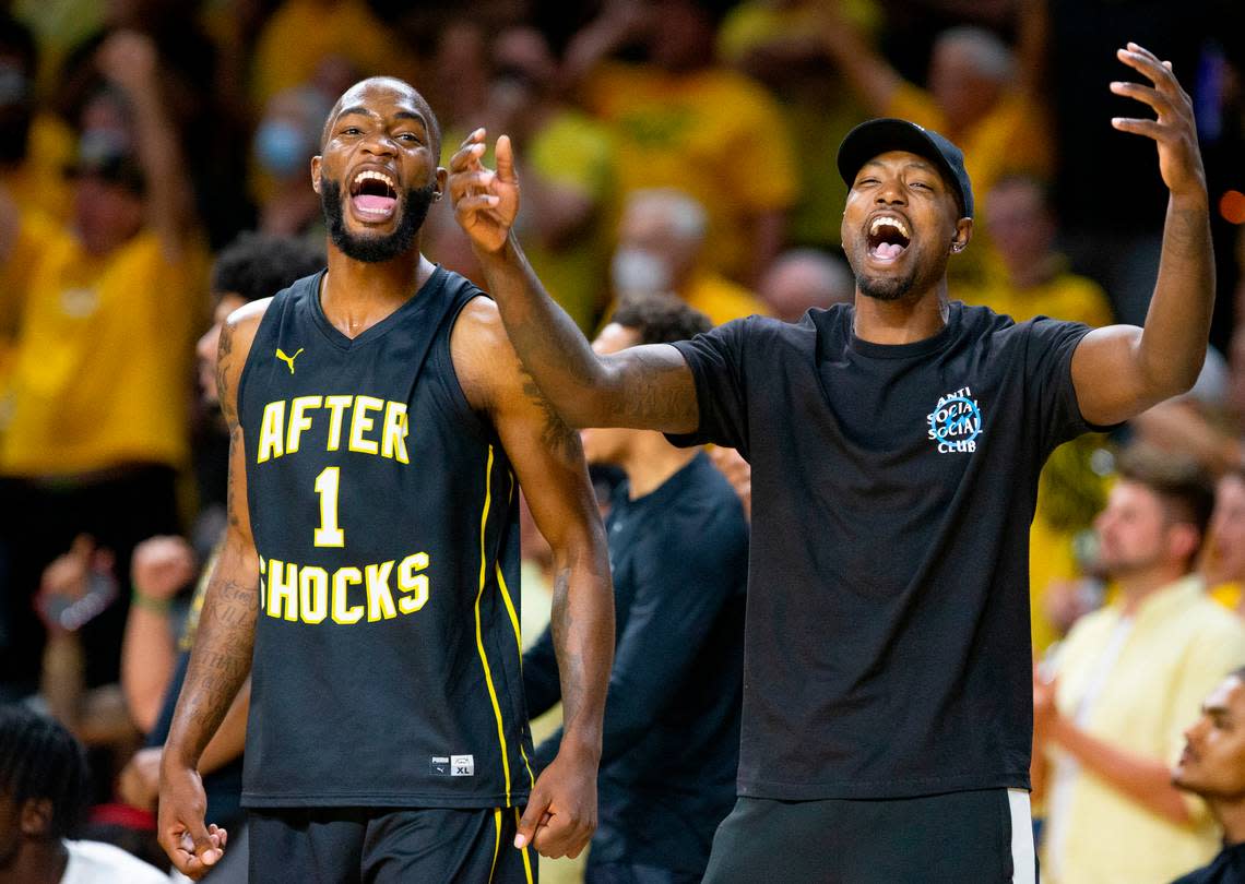 Markis McDuffie (left) and Zach Brown (right) celebrate during the AfterShocks’ 74-67 win over Gutter Cat Gang at Koch Arena on Wednesday.