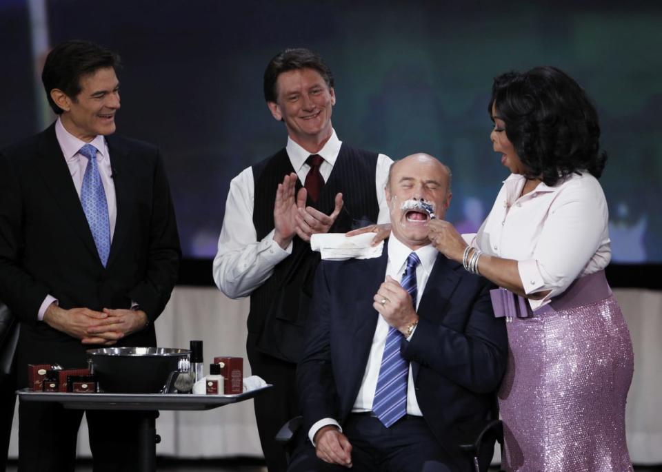 <div class="inline-image__caption"><p>Dr. Oz watches as Oprah Winfrey shaves off the moustache of television personality Dr. Phil in 2010.</p></div> <div class="inline-image__credit">Lucas Jackson/Reuters</div>