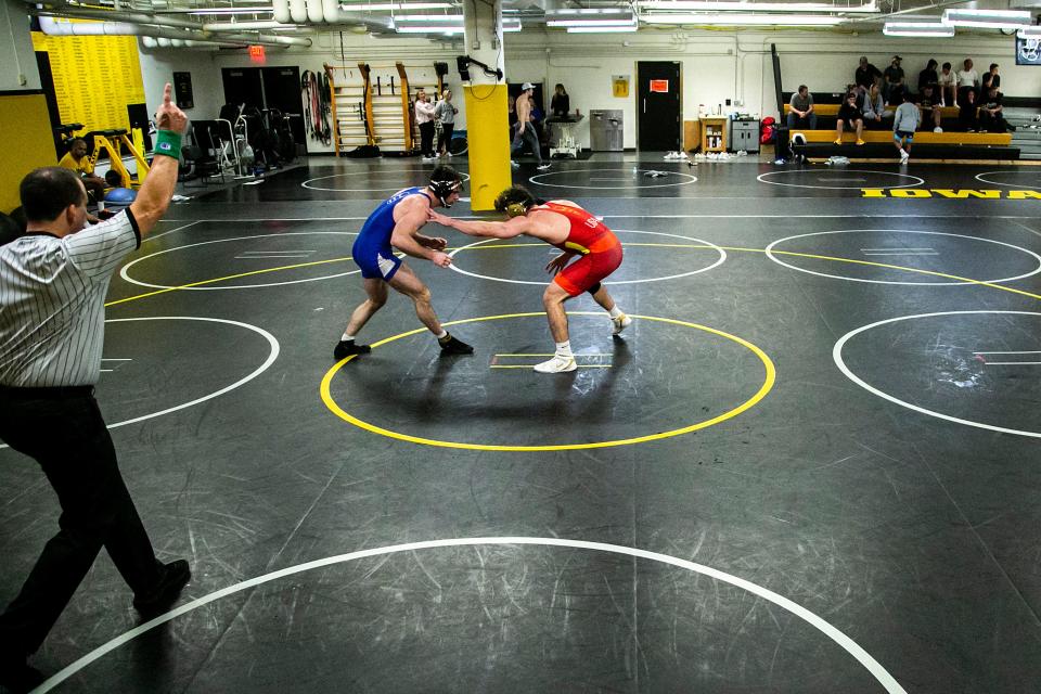 Iowa's Brennan Swafford, left, wrestles Abe Assad during a NCAA Hawkeyes men's wrestling intrasquad match, Friday, Nov. 5, 2021, at the Dan Gable Wrestling Complex in Carver-Hawkeye Arena in Iowa City, Iowa.