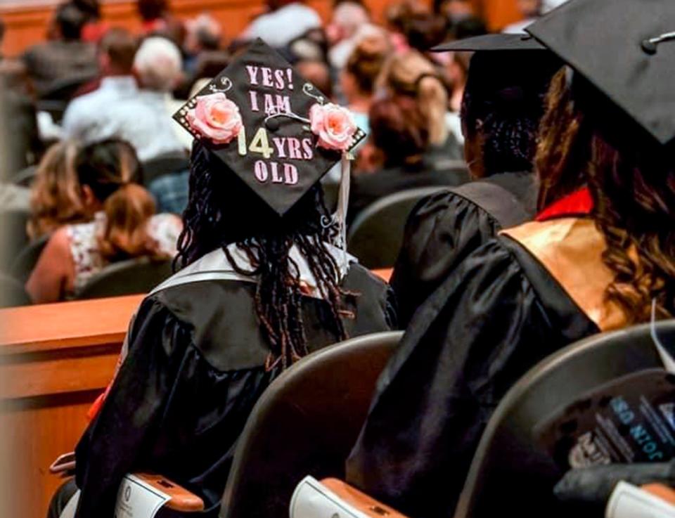 Shania Muhammad's graduation cap says "Yes! I am 14 years old," as she graduated with associate degrees from both Langston University and Oklahoma City Community College at just 14.