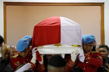 Presidential guards carry the casket of former Indonesian President B.J. Habibie, who passed away this afternoon, at Gatot Soebroto Army hospital in Jakarta