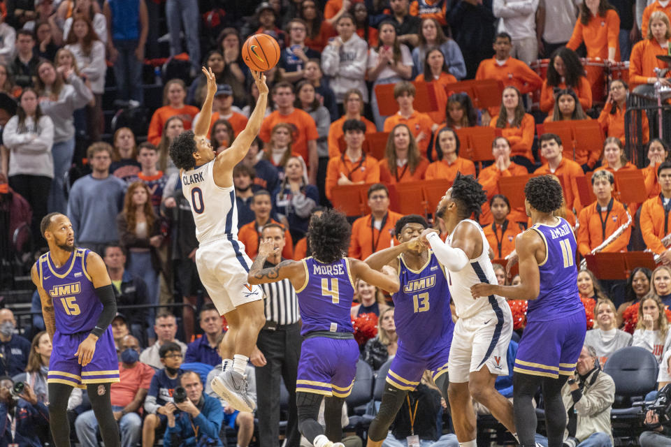 Virginia guard Kihei Clark (0) shoots against James Madison during the first half of an NCAA college basketball game in Charlottesville, Va., Tuesday, Dec. 6, 2022. (AP Photo/Erin Edgerton)