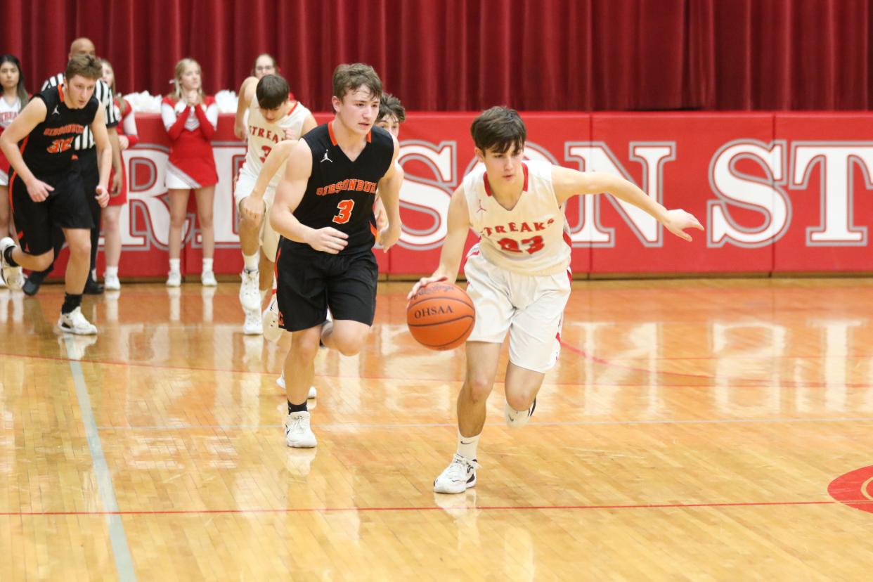 SJCC's Clay Stull handles the ball.