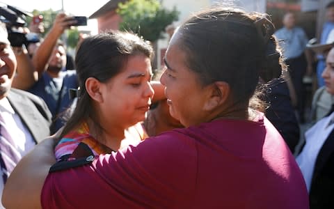 Miss Cortez is embraced by her mother after her acquittal in what is seen as a landmark case in El Salvador, home to some of the world's strictest anti-abortion laws - Credit: Jose Cabezas/Reuters
