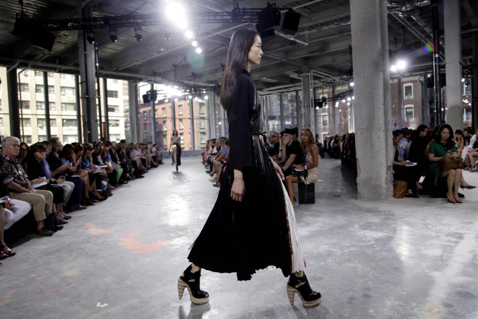 The Proenza Schouler Spring 2014 collection is modeled during Fashion Week in New York, Wednesday, Sept. 11, 2013. (AP Photo/Seth Wenig)