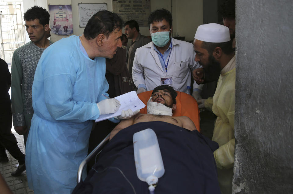 A wounded man receives treatment at a hospital after an explosion in Kabul, Afghanistan, Wednesday, Aug. 7, 2019. A suicide car bomber targeted the police headquarters in a minority Shiite neighborhood in western Kabul on Wednesday, setting off a huge explosion that wounded dozens of people, Afghan officials said. The Taliban claimed responsibility for the bombing. (AP Photo/Rafiq Maqbool)