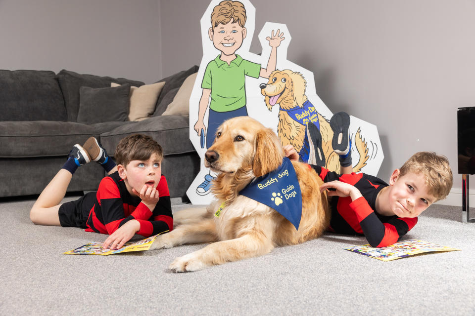 Boys sitting together with dog 