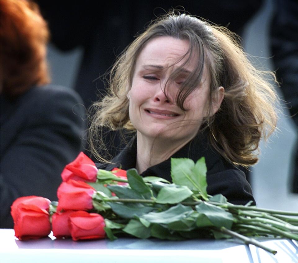 Shawna Prosser looks over casket of her husband, Staff Sgt. Brian Prosser