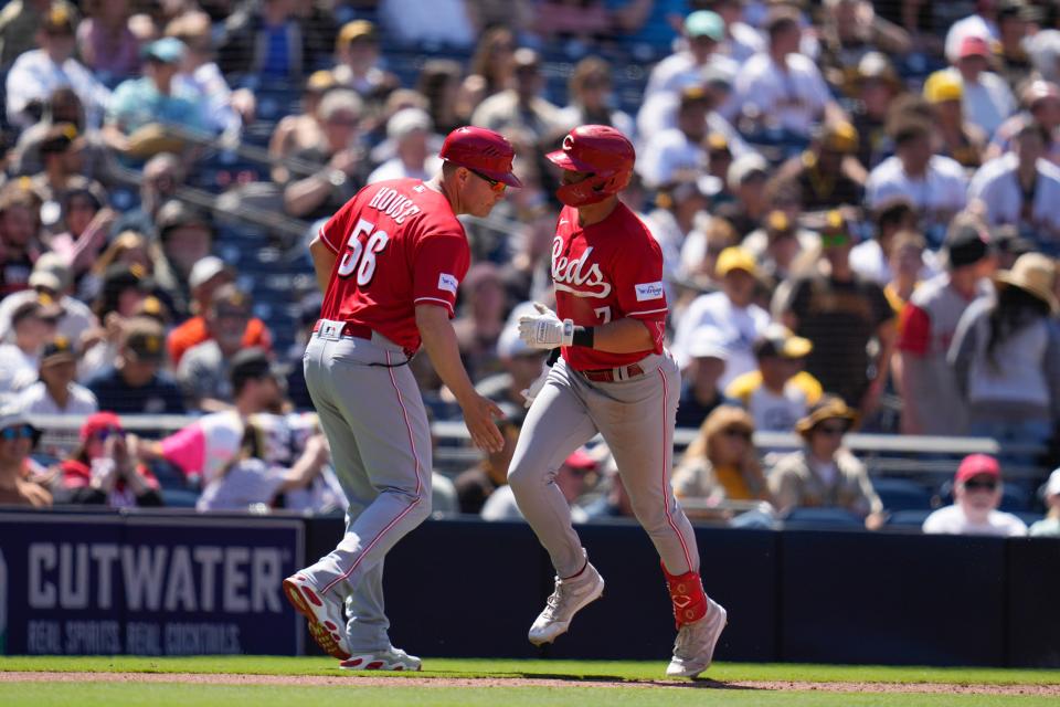 Cincinnati Reds' Spencer Steer, right, is greeted by third base coach J.R. House after hitting a home run during the sixth inning of a baseball game against the San Diego Padres, Wednesday, May 3, 2023, in San Diego.