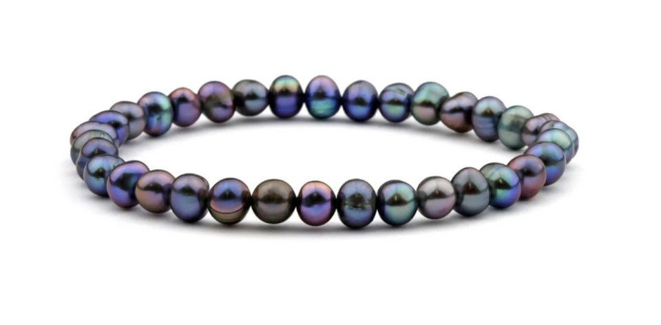 Black Freshwater Pearl Bracelet has many small rainbow-coloured pears strung together.