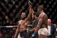 Apr 23, 2016; Las Vegas, NV, USA; Jon Jones (red gloves) reacts after defeating Ovince Saint Preux (blue gloves) during UFC 197 at MGM Grand Garden Arena. Mandatory Credit: Joshua Dahl-USA TODAY Sports