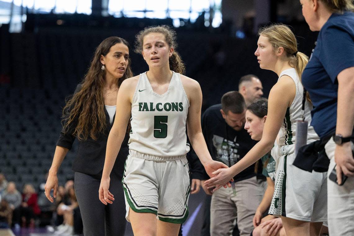 Colfax’s Kaia Diederichs walks off the court after being injured as the Falcons play the Harvard-Westlake Wolverines for the CIF Division II state championship at Golden 1 Center on Saturday, March 9, 2024. She returned after being checked out.