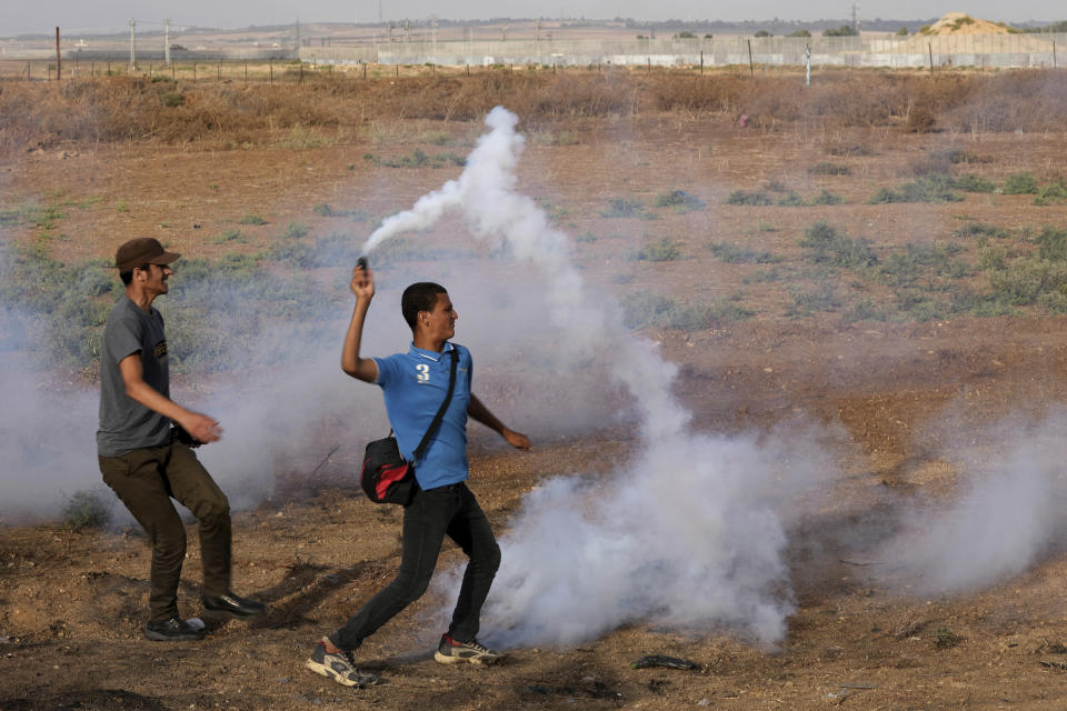 Palestinian protesters clash with Israeli security forces along the frontier with Israel during a demonstration marking Israel's withdrawal from Gaza in 2005, east of Gaza City, Wednesday, Sept. 13, 2023. Activists said at least four people were killed in an explosion. The Israeli army said the blast took place when protesters tried to throw explosives over the fence. (AP Photo/Adel Hana)