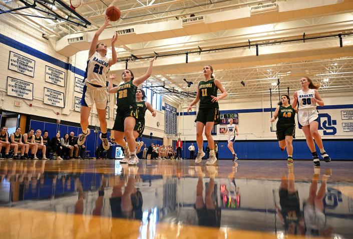 Dover-Sherborn&#39;s Hana Skeary shoots for two during the first half against Tantasqua in the Round of 16 Divsion 3 tournament  at Dover-Sherborn Regional High School, March 8, 2022.  Dover-Sherborn hosted both the boys and girls Round of 16 matchups Tuesday.  