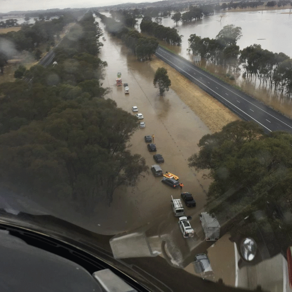 Tropical Cyclone Owen is fuelling wild weather in Victoria. Drivers became trapped on car roofs on a flooded Hume Freeway. 