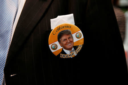 An attendee is seen wearing a pin in support of Republican U.S. presidential candidate Donald Trump at the California Republican Convention in Burlingame, California, U.S., April 29, 2016. REUTERS/Stephen Lam