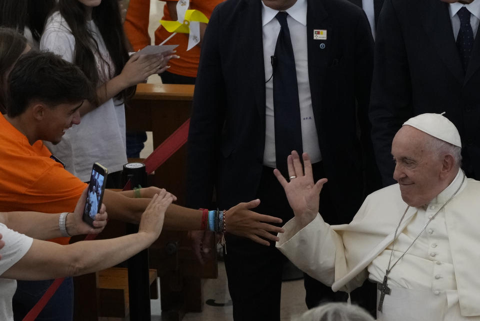 Pope Francis leaves the parish of Serafina at the end of a meeting with representatives of some aid and charity centers ahead of Sunday's 37th World Youth Day in Lisbon, Friday, Aug. 4, 2023. Francis is in Portugal through the weekend to preside over the jamboree that St. John Paul II launched in the 1980s to encourage young Catholics in their faith. The Argentine Jesuit has picked up John Paul's mantle with gusto as he seeks to inspire the next generation to rally behind his key social justice and environmental priorities.(AP Photo/Gregorio Borgia)