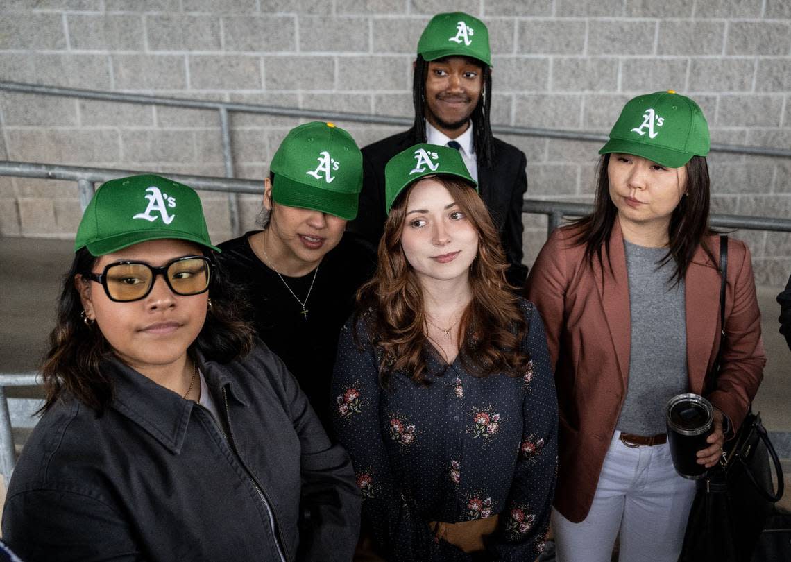 Members of the Greater Sacramento Economic Council wear A’s baseball hats on Thursday, April 4, 2024, in Sutter Health Park after Sacramento River Cats owner Vivek Ranadivé announced that the Oakland Athletics will temporarily relocate to West Sacramento in 2025.