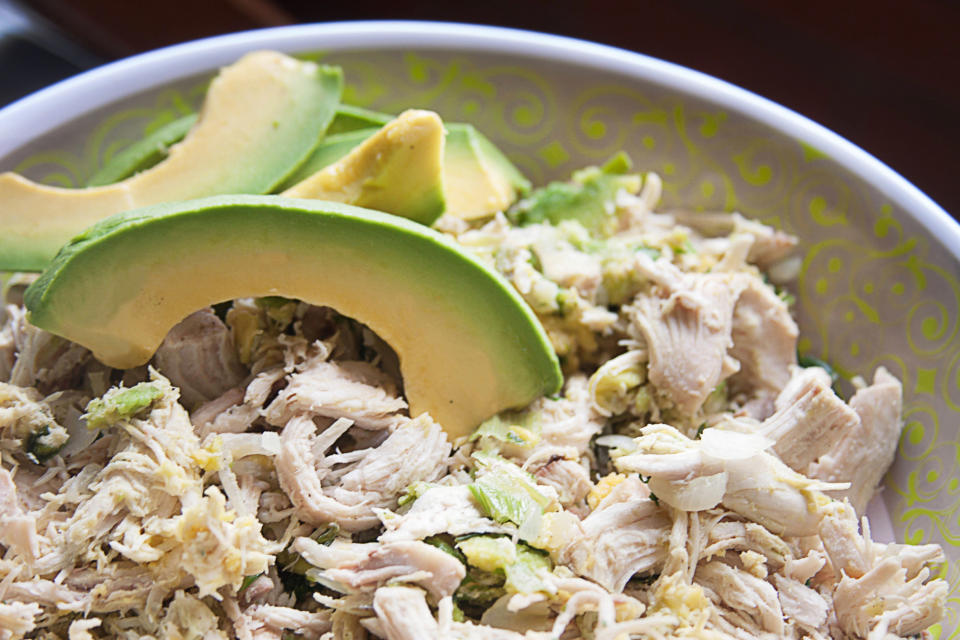 Homemade shredded chicken salad with avocado.