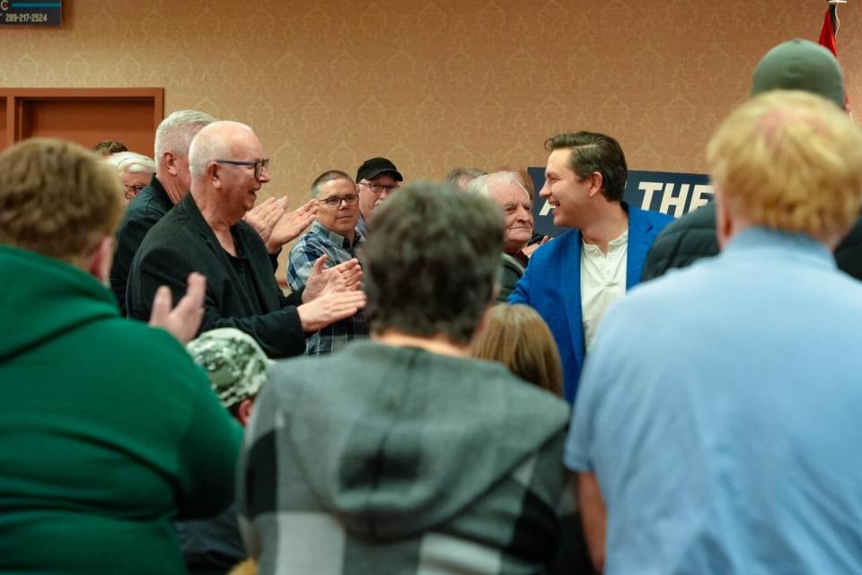 Official opposition leader, Pierre Pollievre, greets supporters following a speech in Gander Wednesday night.