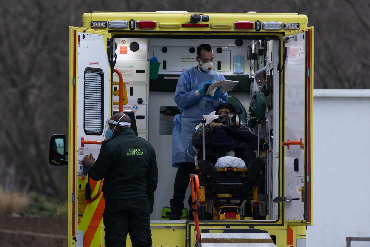 Paramedics prepare to offload a patient on a stretcher outside St Thomas� Hospital in London. Covid-19 hospitalisations are rising in the UK amid the latest wave of Covid-19 infections being fuelled by the Omicron variant. Although the numbers remain far below peak, the infection rate threatens to overwhelm the NHS, and may cause staff shortages as workers are forced to quarantine. (Photo by Tejas Sandhu / SOPA Images/Sipa USA)