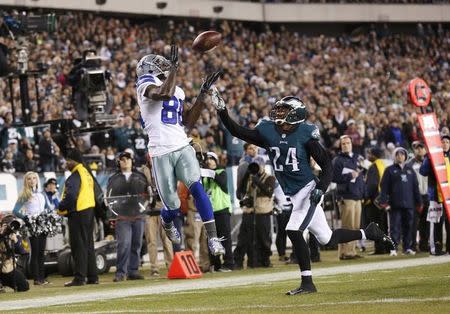 Dallas Cowboys wide receiver Dez Bryant (88) makes a catch for a touchdown as Philadelphia Eagles cornerback Bradley Fletcher (24) defends in the second quarter at Lincoln Financial Field. Mandatory Credit: Bill Streicher-USA TODAY Sports