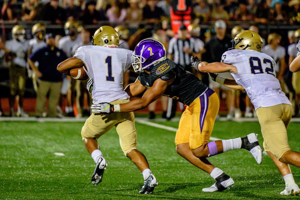 Hickman's Elijah Morton (2) gets a tackle for loss against Helias last Friday night.