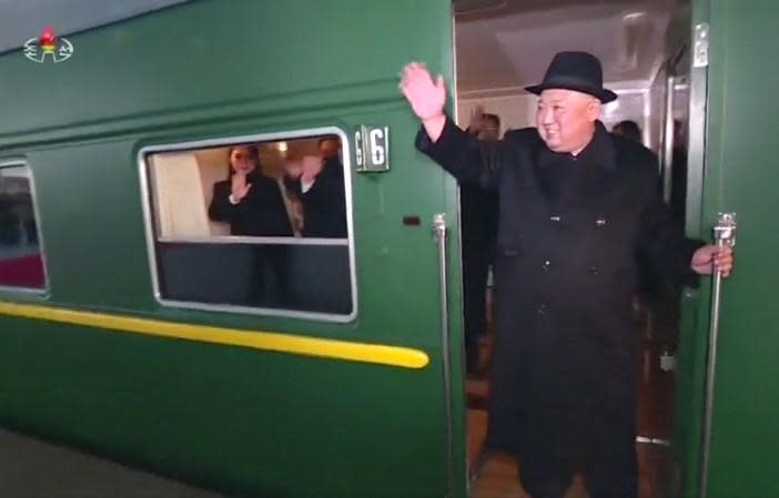 North Korean leader Kim Jong Un waves from his train before it departs from Pyongyang to make a trip to Beijing, China, Jan. 7, 2019. / Credit: Reuters/Handout