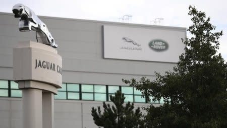 Signs are seen outside the Jaguar Land Rover plant at Halewood in Liverpool, northern England, September 12 , 2016. REUTERS/Phil Noble