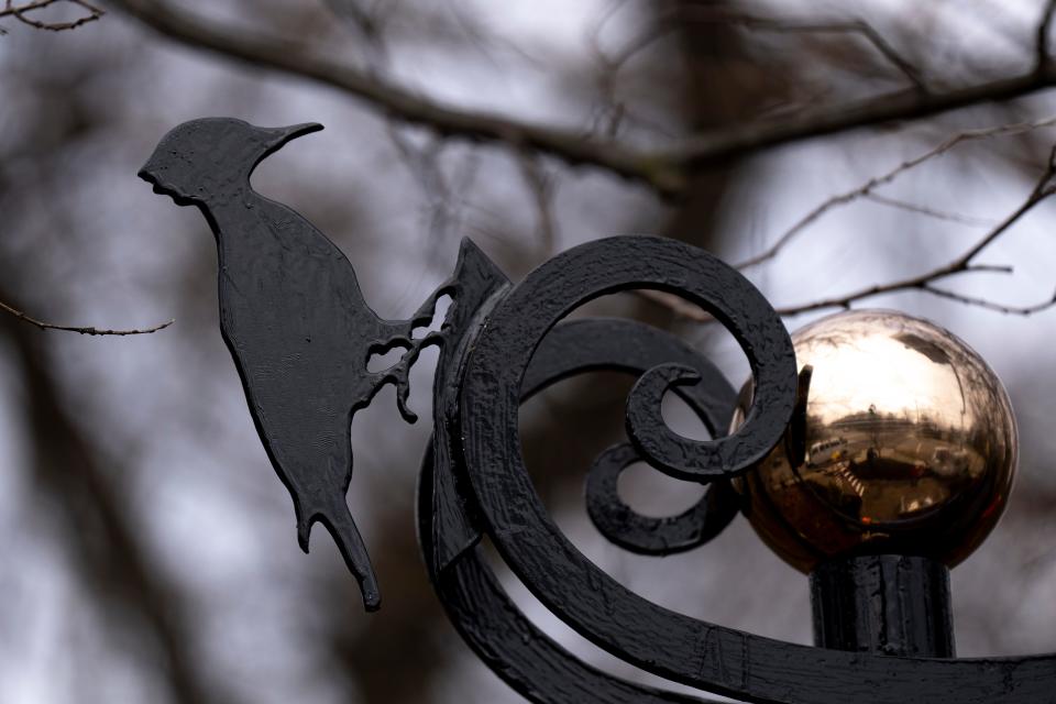 Stephen Mergner added four decorative birds to the welcoming arch at Clifton's Rawson Woods Bird Preserve. They include a woodpecker, mourning dove, hawk and robin.
