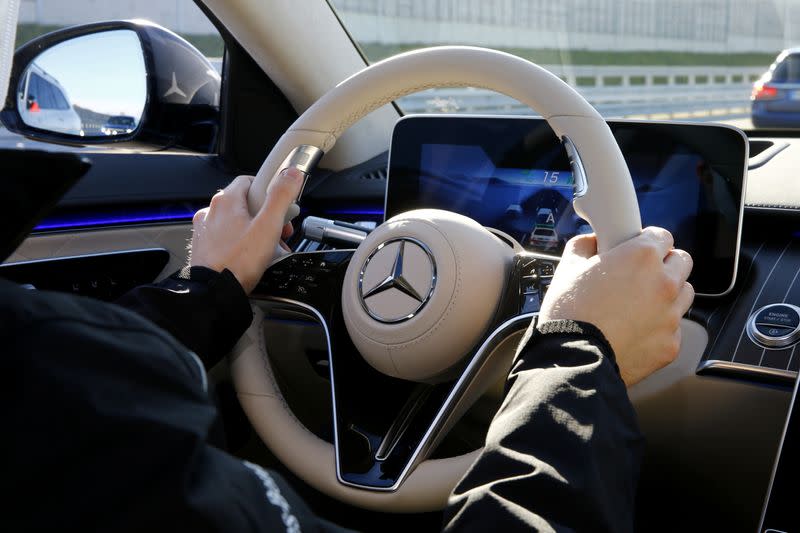 An employee steers a new Mercedes-Benz S-Class limousine near Immendingen