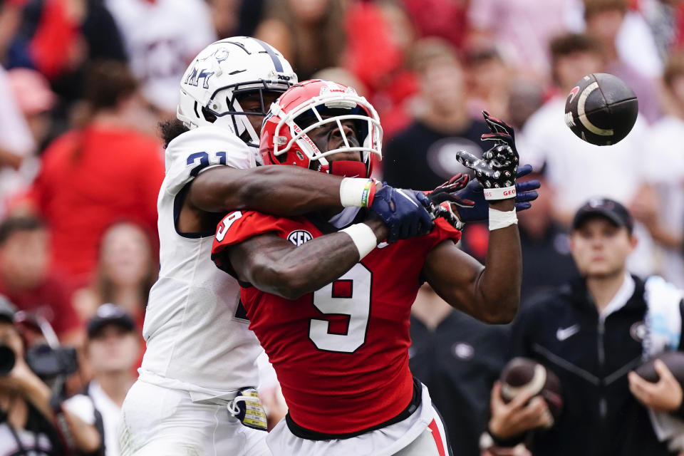 Samford defensive back Isaiah Richardson (21) breaks up a pass intended for Georgia's Jackson Meeks (9) during the first half of an NCAA college football game, Saturday, Sept. 10, 2022 in Athens, Ga. (AP Photo/John Bazemore)