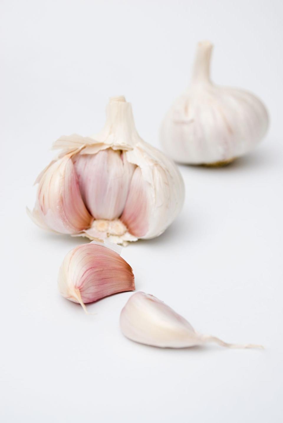 <p>The active ingredient, allicin, may help to keep cholesterol levels low, protect your cells from oxidative damage, and normalize blood pressure and blood sugar. Raw, minced garlic offers the most health bang for your buck, says Dr. Bowers, co-author of <em><a href="https://order.hearstproducts.com/subscribe/hstproducts/239737" rel="nofollow noopener" target="_blank" data-ylk="slk:Secrets of the World's Healthiest People;elm:context_link;itc:0;sec:content-canvas" class="link ">Secrets of the World's Healthiest People</a></em>. Add it to fresh homemade salsa, stir into ranch dressings, use minced garlic and olive oil as a topping for toast, or mash it into guac.</p>