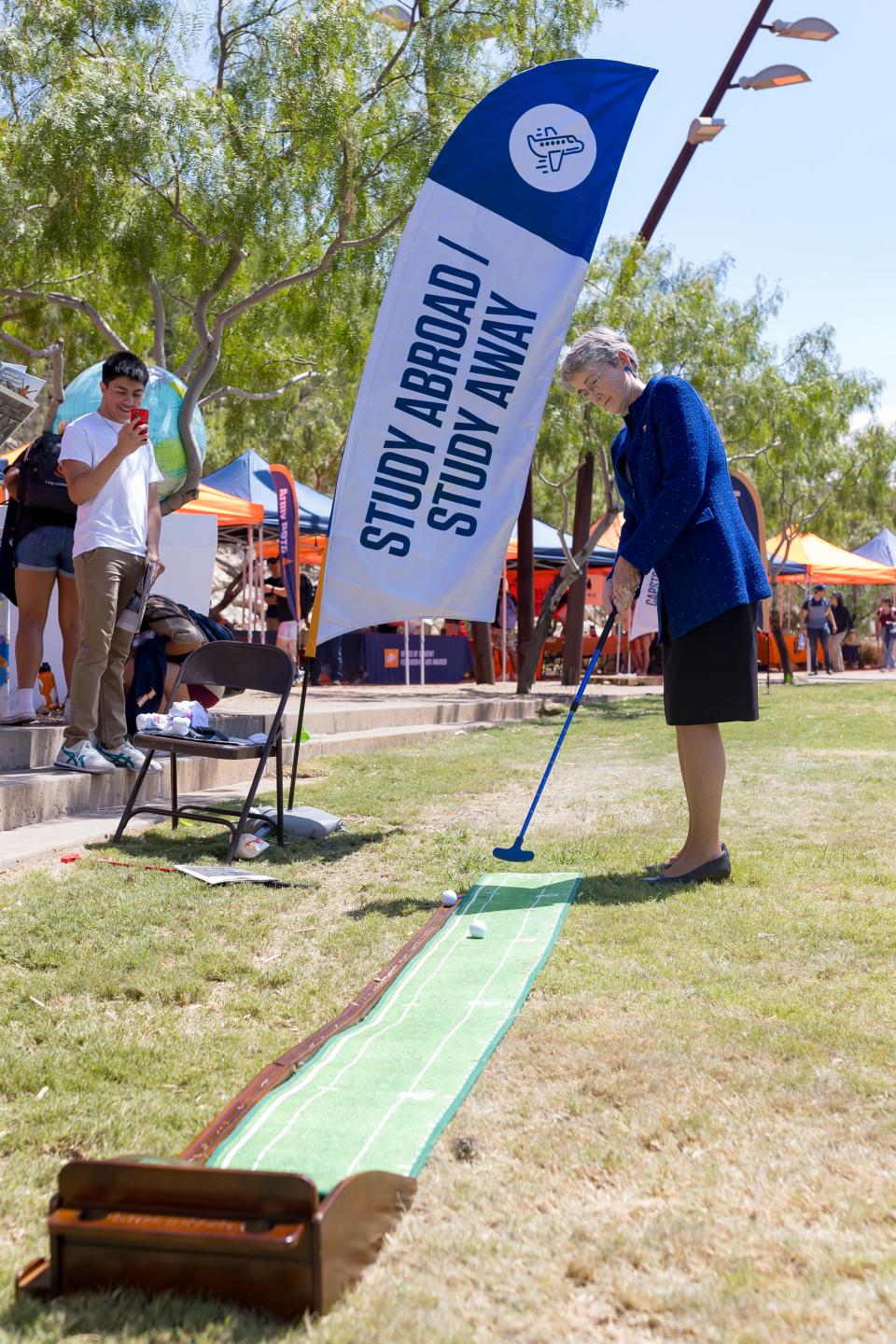 UTEP President Heather Wilson tries mini golf at Centennial Plaza on the UTEP campus for the Get Involved & Well-being Fair on Wednesday, Aug. 30, 2023.