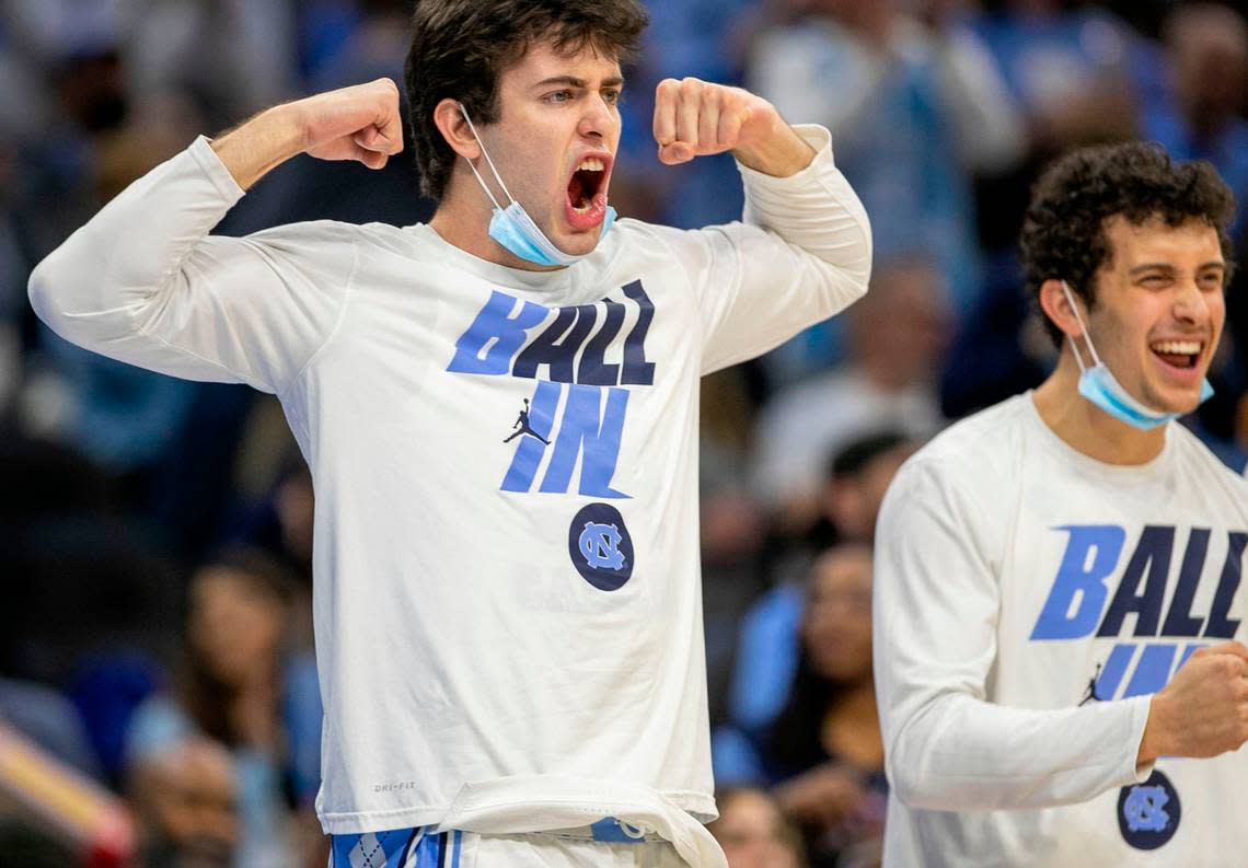North Carolina’s Duwe Farris (34) and Creighton Lebo (25) react after a basket by Armando Bacot (5) during the second half in the NCAA East Regional final on Sunday, March 27, 2022 at Wells Fargo Center in Philadelphia, Pa.