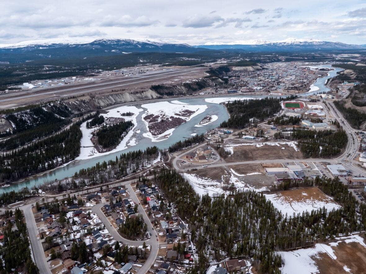 The Selkirk aquifer in Riverdale, visible at the bottom right of this photo, currently provides all of Whitehorse's drinking water. Councillors want more information before approving a costly upgrade to the city's water treatment plant.  (Vincent Bonnay/Radio-Canada - image credit)