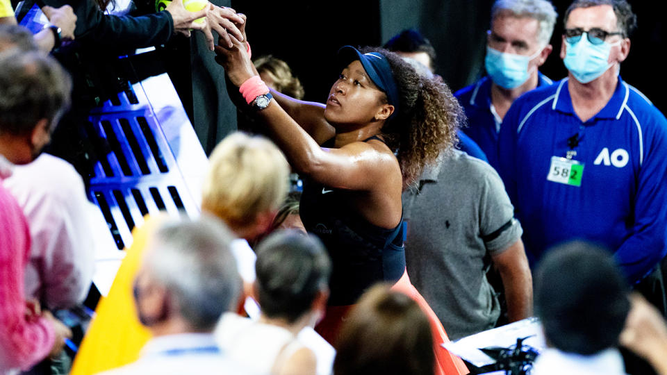 Naomi Osaka, pictured here signing autographs after her victory in the Australian Open final.