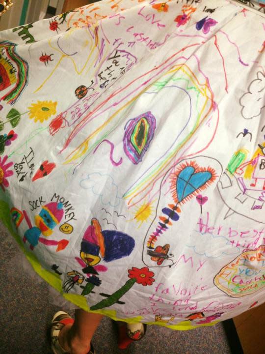 A close-up of the dress decorated with the students' artwork. (Photo: Facebook/ShaRee Castlebury)