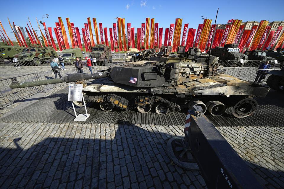 A U.S. made M1A1 Abrams tank, foreground, hit and captured by Russian troops during the fighting in Ukraine is seen on display in Moscow, on Wednesday, May 1, 2024. An exhibition of military equipment captured from Kyiv forces during the fighting in Ukraine has opened in the Russian capital. (AP Photo/Alexander Zemlianichenko)